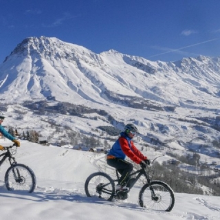 An electric mountain bike ride on snow - thumbnail