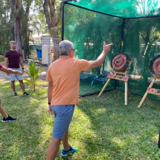 An axe-throwing stand at your event